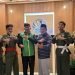 Muhammad Aji Wicaksono (sabuk putih) foto bersama dengan Ketua DPD LDII Kota Balikpapan H. Herry Fathamsyah, Ketua PERSINAS ASAD Joko Yawiono, Sekretaris Imam Ghazali, Emir Daryl Fatah, dan pelatih. Foto: Jamil/LINES